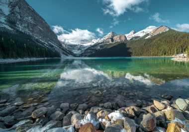 breathtaking-shot-beautiful-stones-turquoise-water-lake-hills-background 1